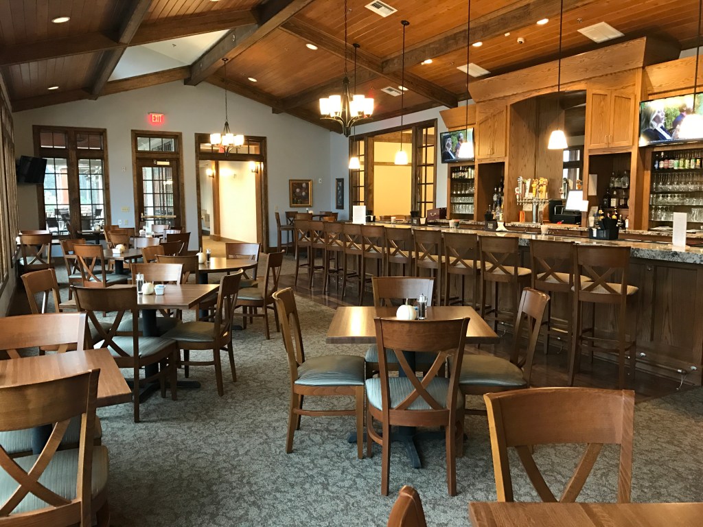 dining area with bar in the background at the Eagles Nest